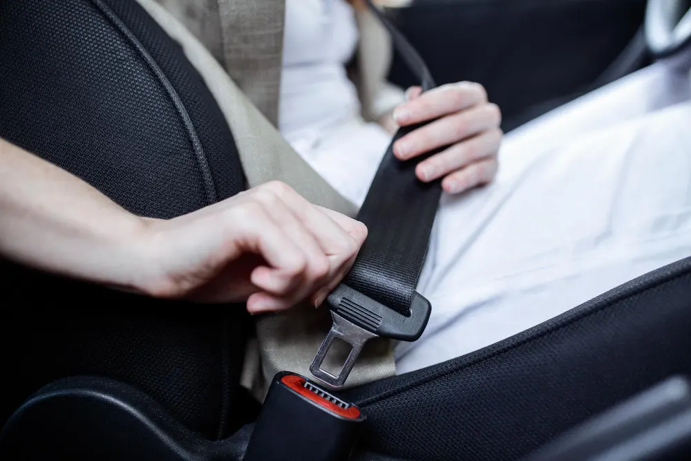 woman-fastening-safety-belt