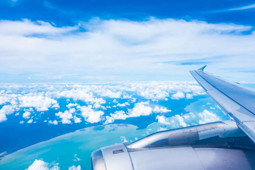 aerial-view-of-airplane-wing-with-blue-sky