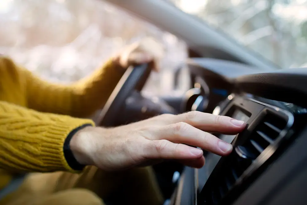 close-up-hand-holding-steering-wheel