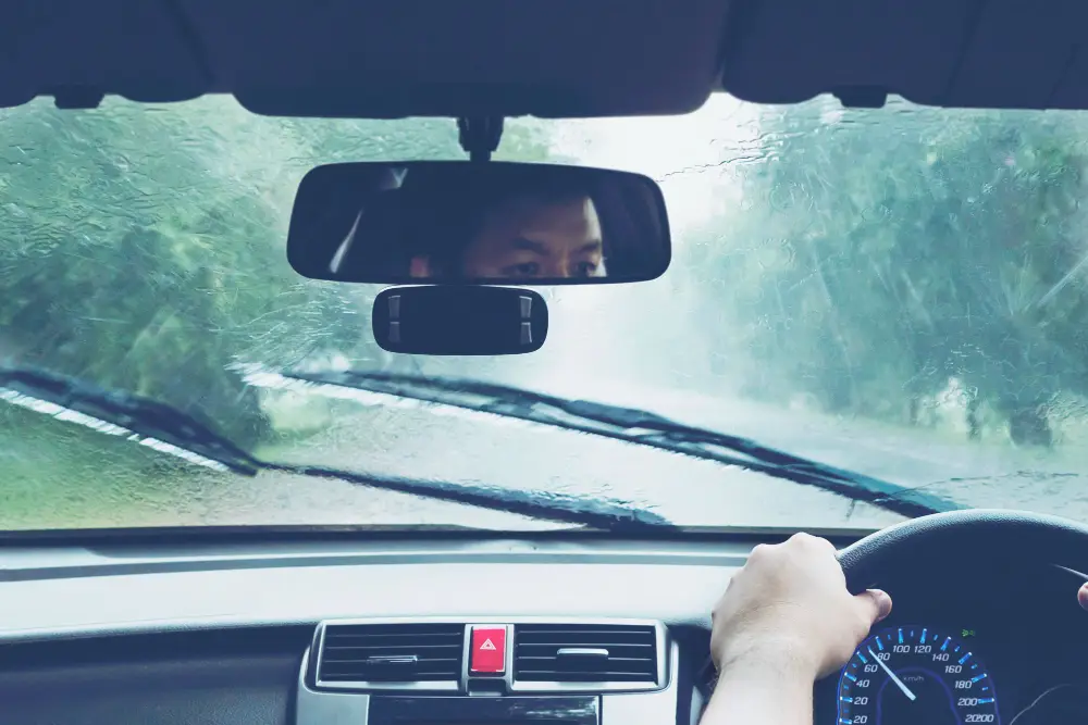 man-driving-car-in-heavy-rainfall