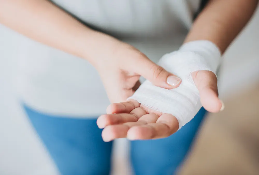 woman-with-gauze-bandage-wrapped-around-her-hand