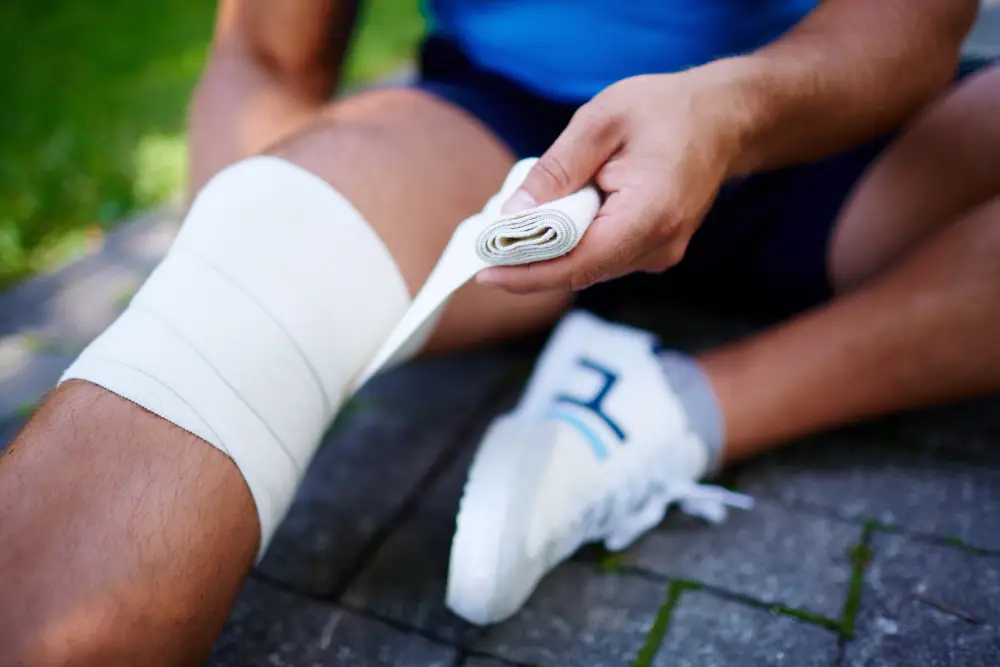 close-up-of-sportsman-with-knee-sprain