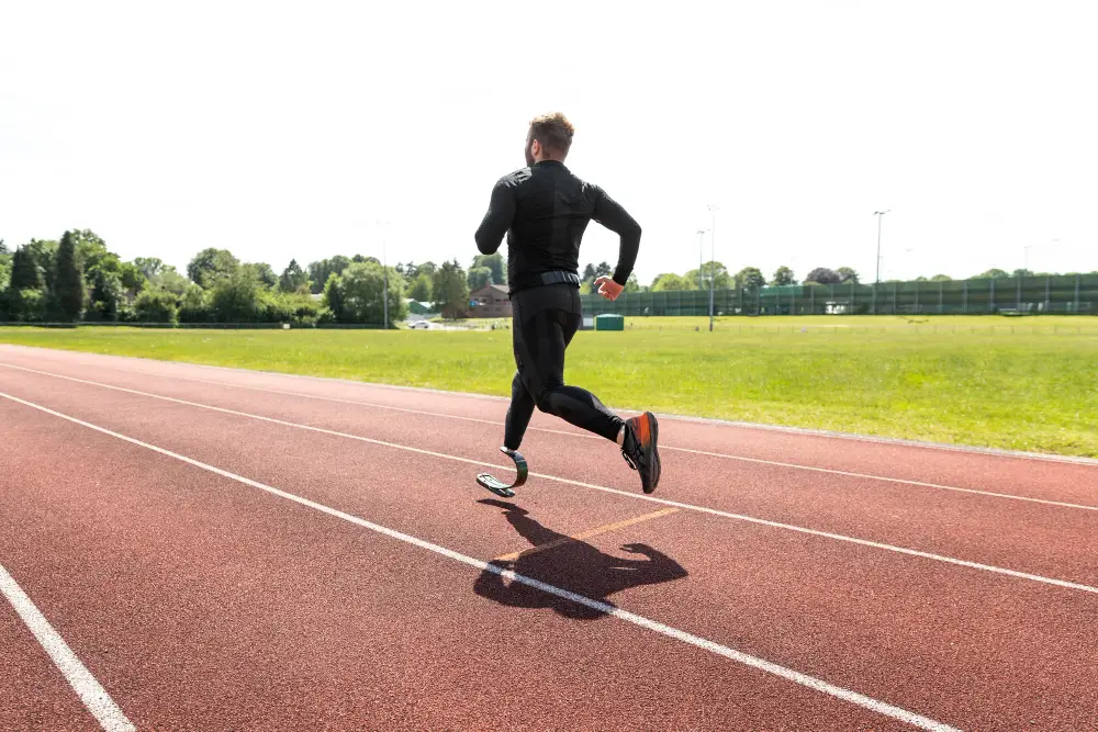 full-shot-man-with-prosthesis-running-on-running-track