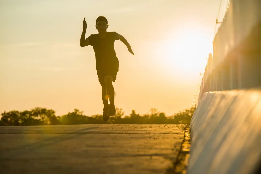 silhouette-of-a-young-fitness-man-running-on-sunrise