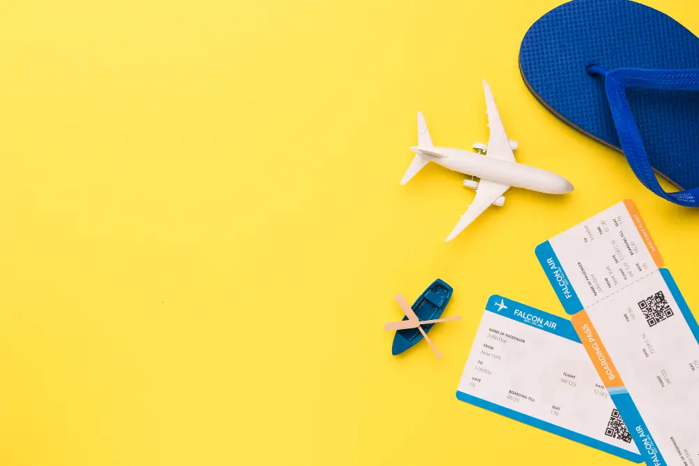 Composition-of-toy-airplane-boat-tickets-and-flip-flops