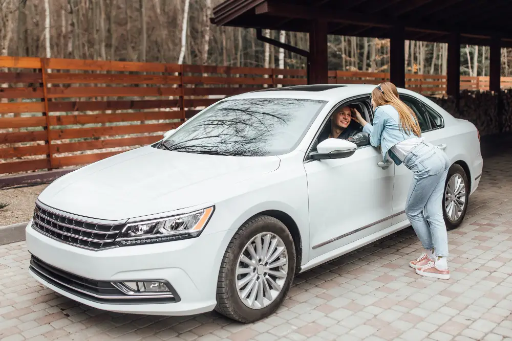 Couple-near-white-car