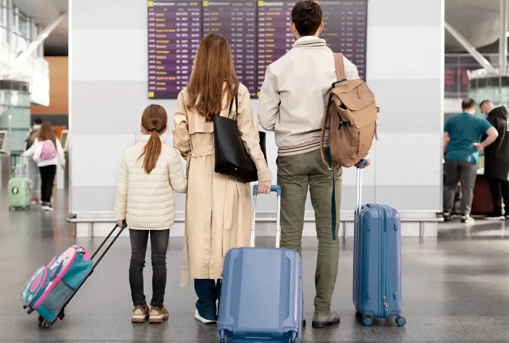 Full-shot-family-at-airport