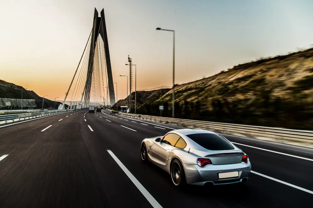 Metallic-color-sport-car-on-the-bridge