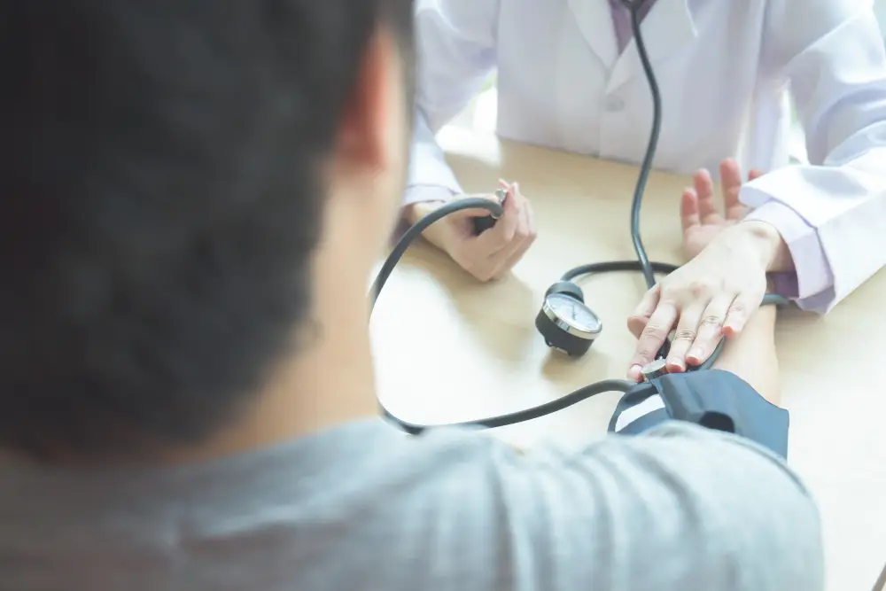 doctor-checking-patient-arterial-blood-pressure