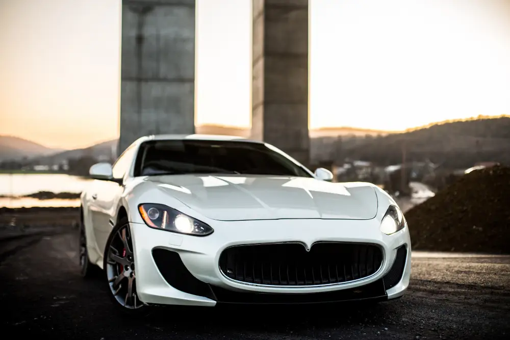 white-coupe-sport-car-standing-on-the-road