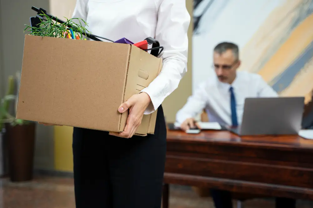 woman-carrying-cardboard-box-side-view