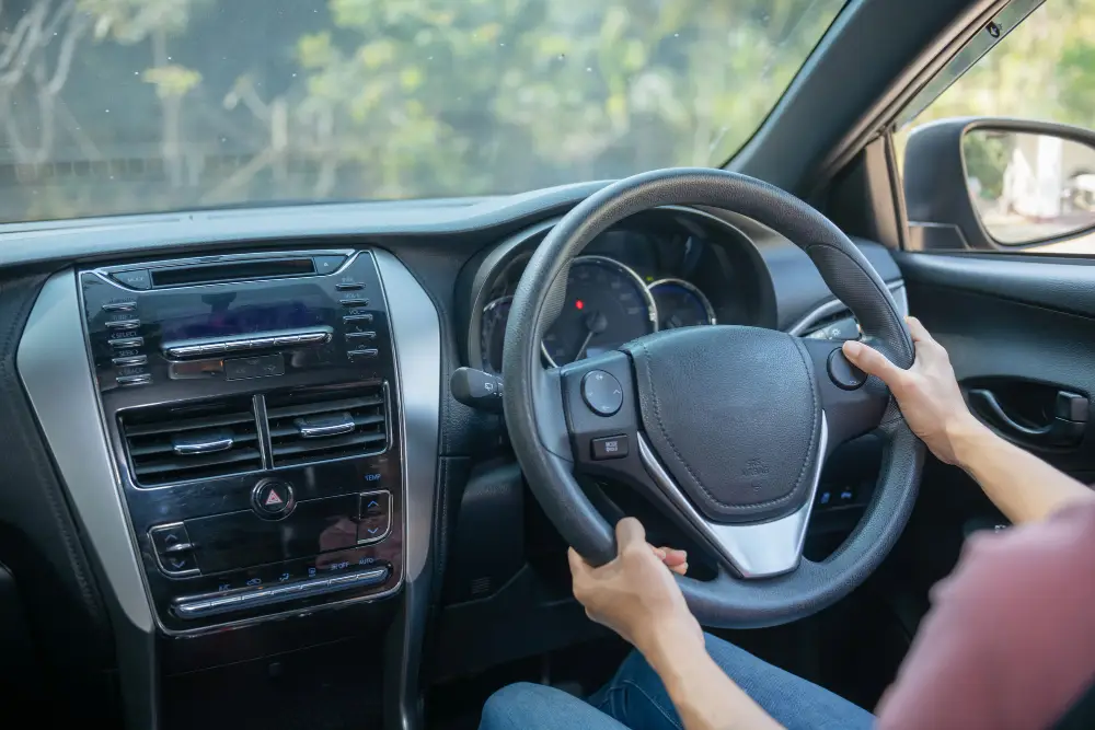 young-woman-in-casual-wear-while-driving-a-car